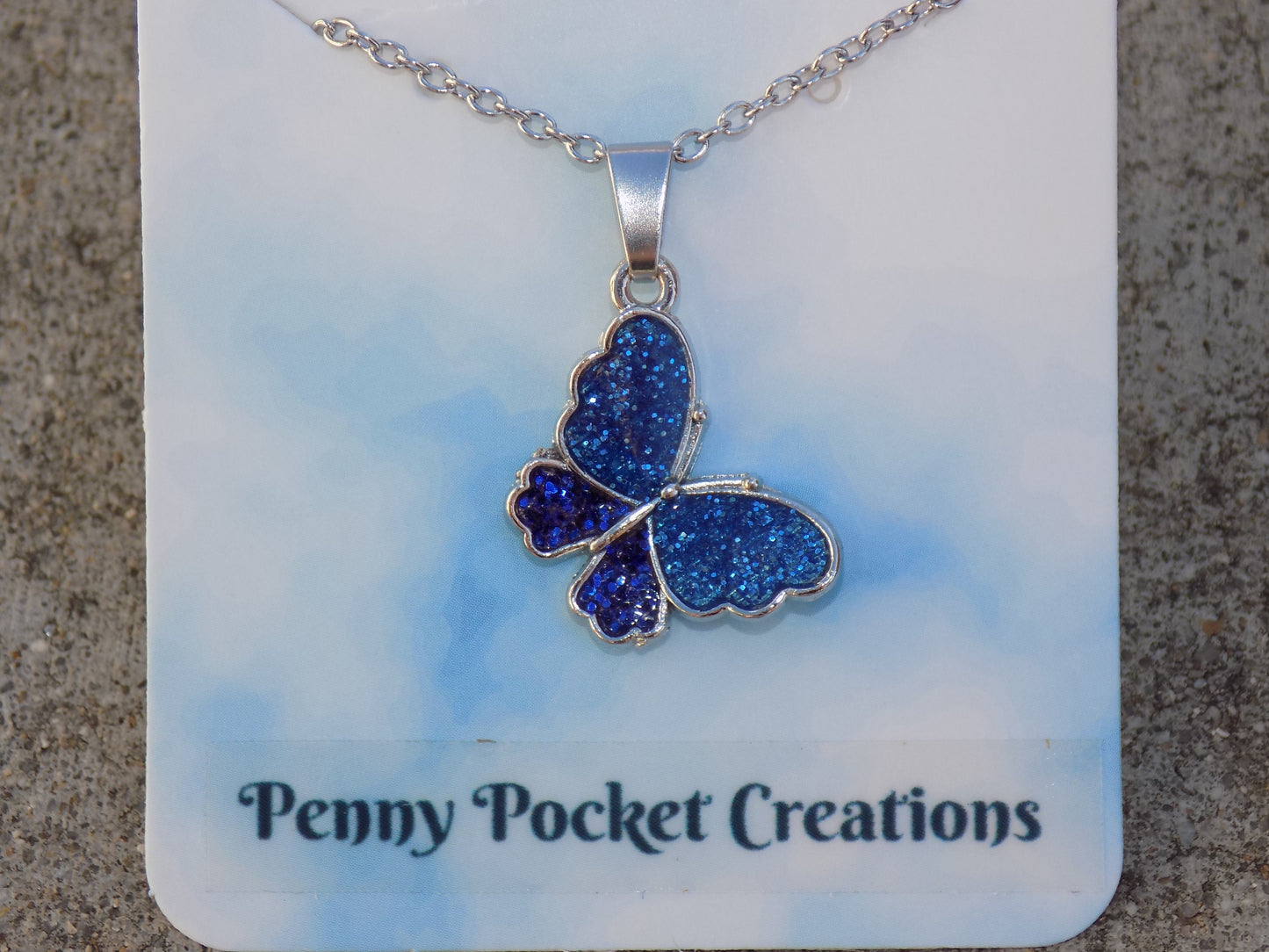 Silvery Butterfly Necklace Blue Glitter Resin Wings