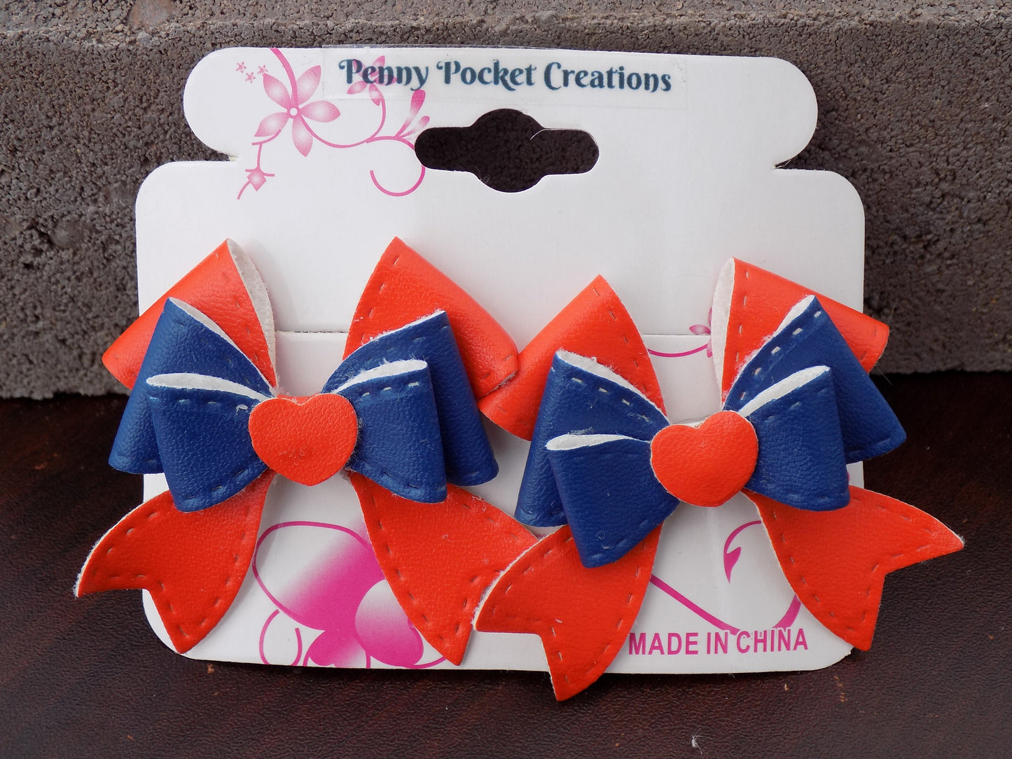 Leather 2-Laye r Bows over Contrast Bow Back Outward Bottom Tails Orange/Blue
