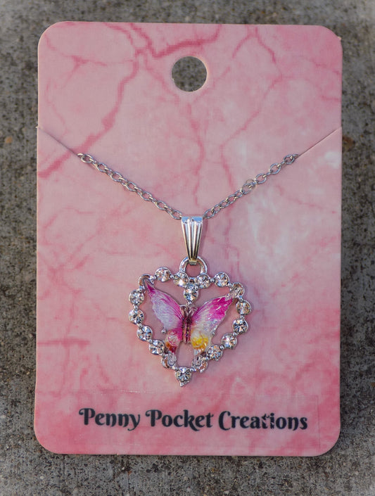 Silvery Sparkling Necklace: Colorful Resin Butterfly framed by Rhinestone Heart