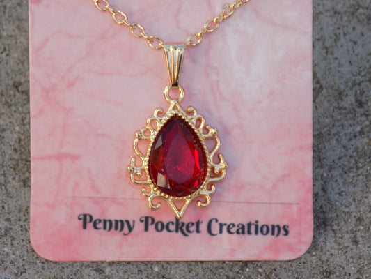 Golden Necklace Translucent Color Teardrop Faux Crystal in Filigree Frame